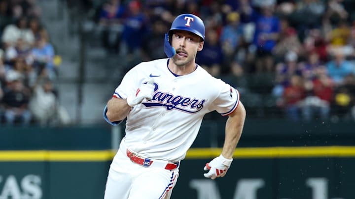 Texas Rangers center fielder Evan Carter runs the bases during his inside-the-park home run. 