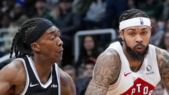 Toronto Raptors forward Brandon Ingram dribbles the ball against Brooklyn Nets guard/forward Terance Mann.