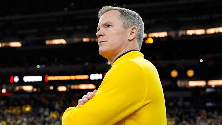 Michigan head coach Dusty May looks on from the court ahead of the NCAA national championship game against Connecticut at Lucas Oil Stadium in Indianapolis on Monday, April 6, 2026. Michigan head coach Dusty May looks on from the court ahead of the NCAA national championship game against Connecticut at Lucas Oil Stadium in Indianapolis on Monday, April 6, 2026.