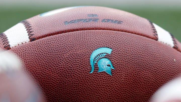 Oct 12, 2019; Madison, WI, USA; Michigan State Spartans logo on footballs during warmups prior to the game against the Wisconsin Badgers at Camp Randall Stadium. Mandatory Credit: Jeff Hanisch-Imagn Images