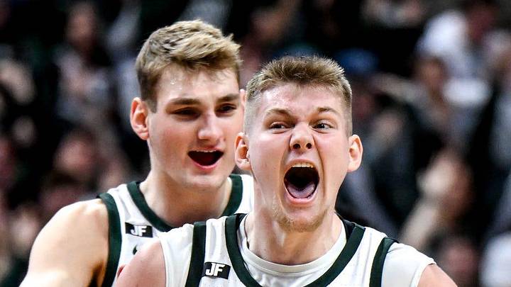 Michigan State's Jaxon Kohler, right, celebrates with teammates Carson Cooper, center, and Gehrig Normand, left, after a MSU score and Nebraska timeout during the second half on Saturday, Dec. 7, 2024, at the Breslin Center in East Lansing.