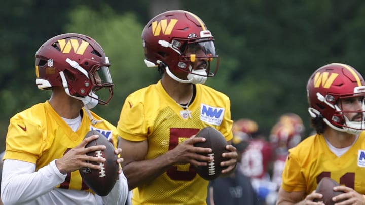 Jun 5, 2024; Ashburn, VA, USA; (L-R) Washington Commanders quarterback Jeff Driskel (16), Commanders quarterback Marcus Mariota (0), Commanders quarterback Jayden Daniels (5), and Commanders quarterback Sam Hartman (11) drop back to pass during an OTA workout at Commanders Park. Mandatory Credit: Geoff Burke-USA TODAY Sports Jun 5, 2024; Ashburn, VA, USA; (L-R) Washington Commanders quarterback Jeff Driskel (16), Commanders quarterback Marcus Mariota (0), Commanders quarterback Jayden Daniels (5), and Commanders quarterback Sam Hartman (11) drop back to pass during an OTA workout at Commanders Park. Mandatory Credit: Geoff Burke-USA TODAY Sports