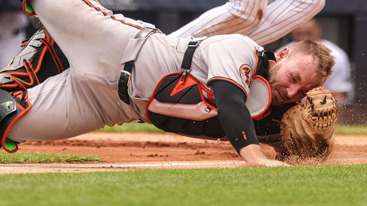 Jun 22, 2025; Bronx, New York, USA; New York Yankees second baseman Jazz Chisholm Jr. (13) collides with Baltimore Orioles catcher Maverick Handley (98) at home plate during the second inning at Yankee Stadium