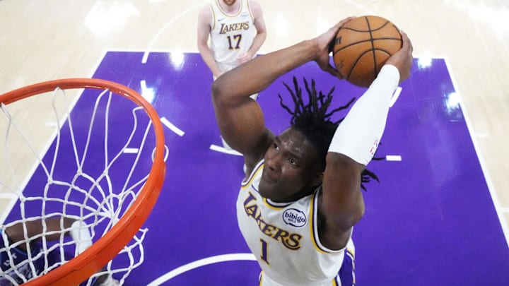 Apr 12, 2026; Los Angeles, California; Los Angeles Lakers forward Adou Thiero (1) dunks the ball against the Utah Jazz  in the second half at Crypto.com Arena. Mandatory Credit: Kirby Lee-Imagn Images