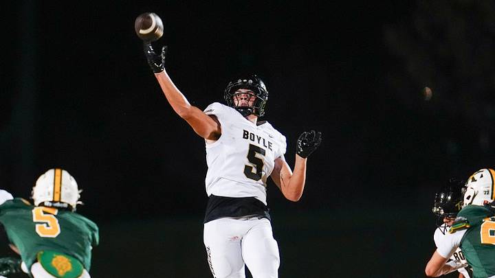 Boyle County High School's Seneca Driver (5) throws during a flea flicker play against St. X during KHSAA football at Brother Thomas More Page Stadium in Louisville, Kentucky. Oct. 2, 2026. The Rebels continue to move up in the rankings after dropping out of the top five in mid-September. Boyle County High School's Seneca Driver (5) throws during a flea flicker play against St. X during KHSAA football at Brother Thomas More Page Stadium in Louisville, Kentucky. Oct. 2, 2026. The Rebels continue to move up in the rankings after dropping out of the top five in mid-September.
