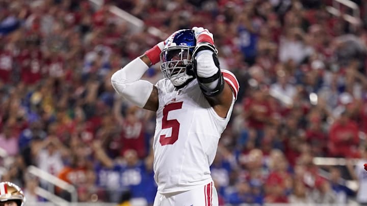 Sep 21, 2023; Santa Clara, California, USA; New York Giants linebacker Kayvon Thibodeaux (5) reacts next to safety Isaiah Simmons (19) and San Francisco 49ers tight end George Kittle (85) after the Giants were called for a penalty in the third quarter at Levi's Stadium. Mandatory Credit: Cary Edmondson-Imagn Images