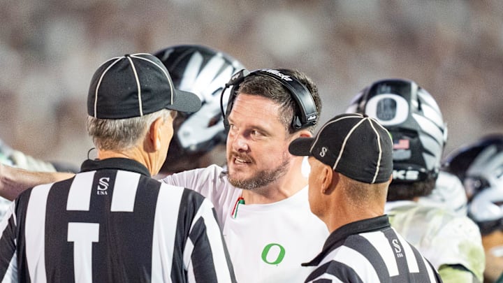 Oregon head coach Dan Lanning talks to the officials in the fourth quarter as the Oregon Ducks face the Penn State Nittany Lions on Sept. 27, 2025, at Beaver Stadium in University Park, Pennsylvania.
