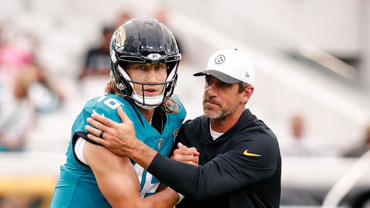 Aug 9, 2025; Jacksonville, Florida, USA; Jacksonville Jaguars quarterback Trevor Lawrence (16) embraces Pittsburgh Steelers quarterback Aaron Rodgers (8) before a preseason game at EverBank Stadium. Mandatory Credit: Travis Register-Imagn Images