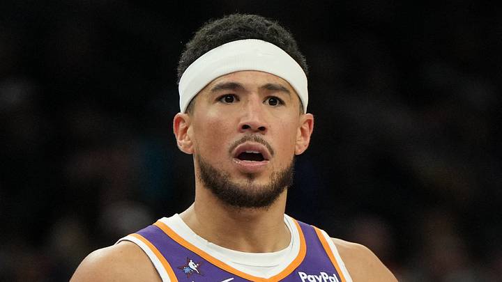 Phoenix Suns guard Devin Booker (1) reacts after a foul call against the Philadelphia 76ers during the second half of an NBA game at Mortgage Matchup Center on February 7, 2026. Phoenix Suns guard Devin Booker (1) reacts after a foul call against the Philadelphia 76ers during the second half of an NBA game at Mortgage Matchup Center on February 7, 2026.