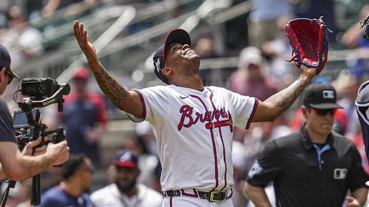 May 15, 2025; Cumberland, Georgia, USA; Atlanta Braves pitcher Raisel Iglesias (26) reacts with catcher Drake Baldwin (30) after the final out against the Washington Nationals during the ninth inning at Truist Park. Mandatory Credit: Dale Zanine-Imagn Images