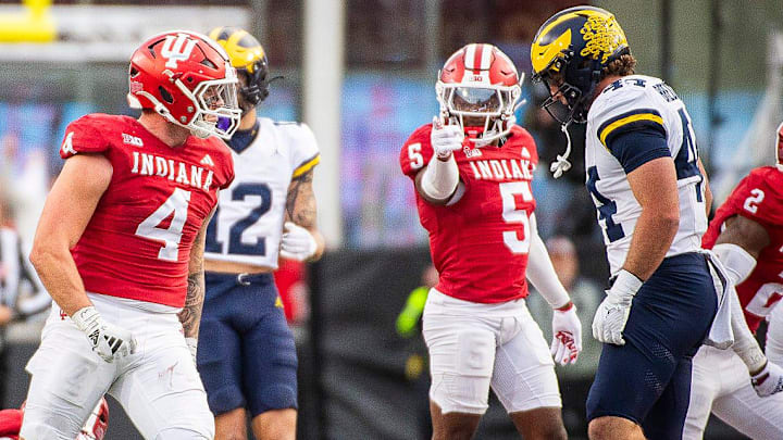 Indiana's Aiden Fisher (4) and D'Angelo Ponds (5) celebrate a fumble recovery against Michigan. Indiana's Aiden Fisher (4) and D'Angelo Ponds (5) celebrate a fumble recovery against Michigan.