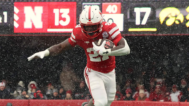 Emmett Johnson rushes for 12 yards on third-and-1 during the second quarter against Iowa.