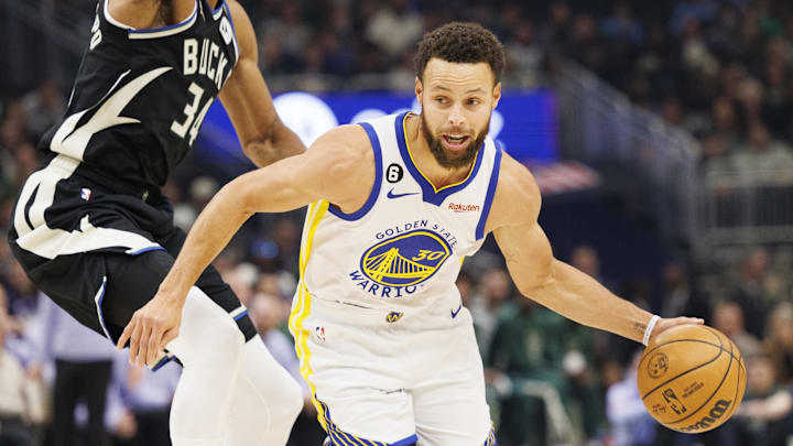Dec 13, 2022; Milwaukee, Wisconsin, USA; Golden State Warriors guard Stephen Curry (30) drives for the basket around Milwaukee Bucks forward Giannis Antetokounmpo (34) during the first quarter at Fiserv Forum. Mandatory Credit: Jeff Hanisch-Imagn Images Dec 13, 2022; Milwaukee, Wisconsin, USA; Golden State Warriors guard Stephen Curry (30) drives for the basket around Milwaukee Bucks forward Giannis Antetokounmpo (34) during the first quarter at Fiserv Forum. Mandatory Credit: Jeff Hanisch-Imagn Images
