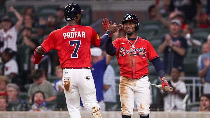 Sep 5, 2025; Atlanta, Georgia, USA; Atlanta Braves left fielder Jurickson Profar (7) celebrates with second baseman Ozzie Albies (1) after scoring a run against the Seattle Mariners in the eighth inning at Truist Park. Mandatory Credit: Brett Davis-Imagn Images
