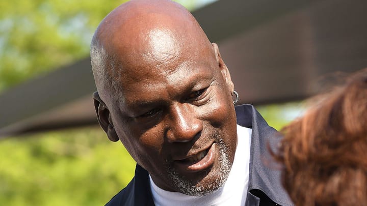 Michael Jordan takes the time to pose for a few photos and greet spectators and friends outside of The Michael Jordan Family Medical Clinic led by Novant Health. A ribbon cutting ceremony for the new clinic opening off of Greenfield Street Tuesday May 7, 2024 in Wilmington, N.C. KEN BLEVINS/STARNEWS
