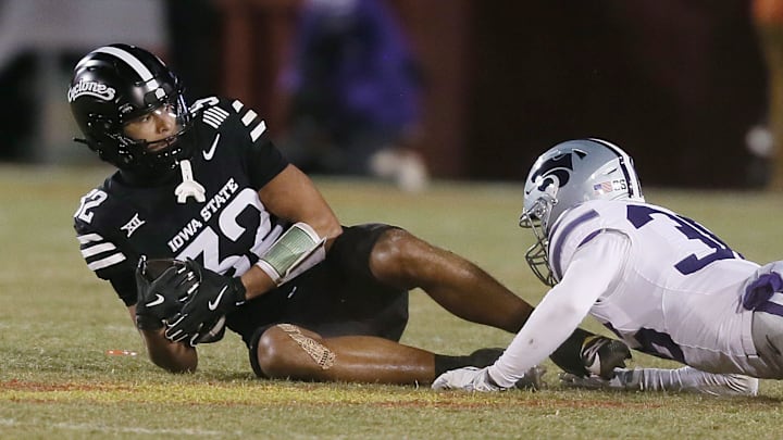 Iowa State Cyclones wide receiver Carson Brown (32) gets tackle by Kansas State Wildcats linebacker Desmond Purnell (32) after making a catch during the third quarter in the NCAA football at Jack Trice Stadium on Saturday, Nov. 30, 2024, in Ames, Iowa.