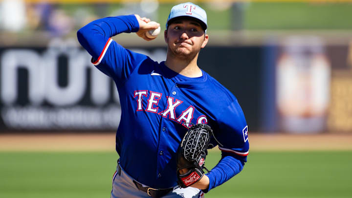Mar 5, 2024; Peoria, Arizona, USA; Texas Rangers pitcher Owen White against the Seattle Mariners during a spring training baseball game at Peoria Sports Complex