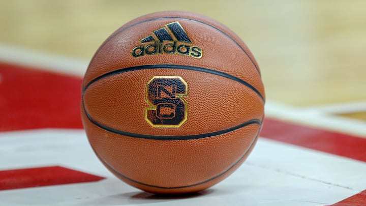 Feb 20, 2019; Raleigh, NC, USA; Basketball with the North Carolina State Wolfpack logo sits on the court during a timeout as the Wolfpack play the Boston College Eagles in the first half at PNC Arena. The North Carolina State Wolfpack won 89-80. Mandatory Credit: Nell Redmond-Imagn Images