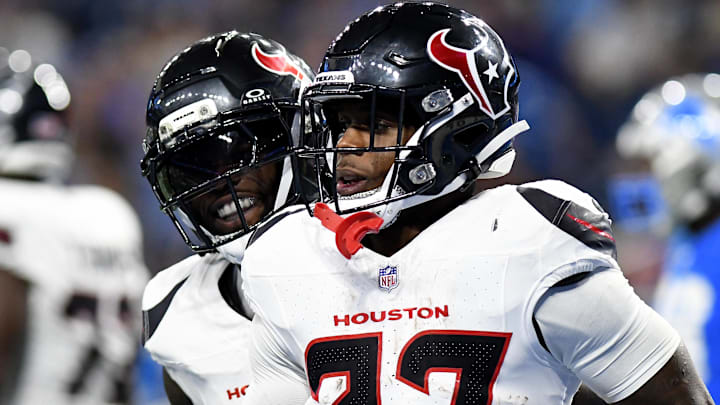 Houston Texans running back Woody Marks (27) celebrates with teammates after scoring a touchdown against the Detroit Lions in the second quarter at Ford Field.