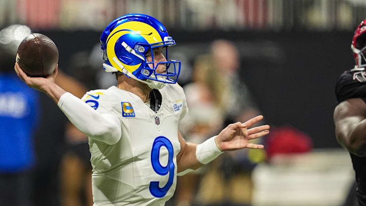 Dec 29, 2025; Atlanta, Georgia, USA; Los Angeles Rams quarterback Matthew Stafford (9) throws an interception to Atlanta Falcons safety Jessie Bates III (3) (not shown) during the first half at Mercedes-Benz Stadium. Mandatory Credit: Dale Zanine-Imagn Images