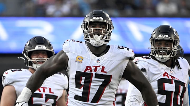Atlanta Falcons defensive end Grady Jarrett reacts with linebacker Nate Landman and defensive end James Smith-Williams.