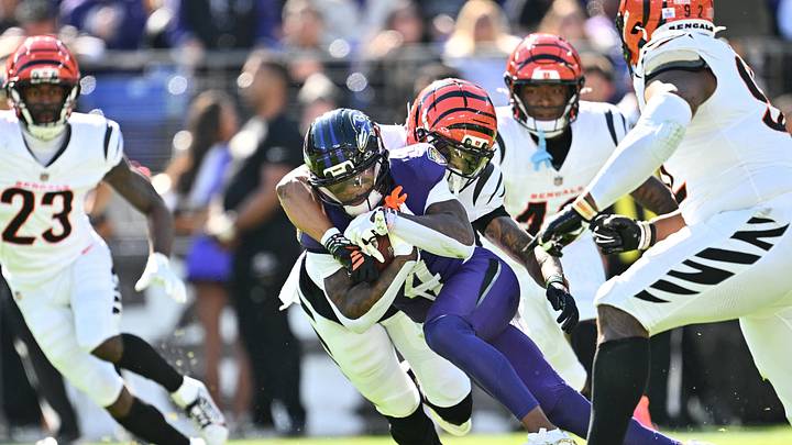 Oct 25, 2026; Baltimore, Maryland, USA; Baltimore Ravens wide receiver Zay Flowers (4) runs the ball defended by Cincinnati Bengals safety Bryan Cook (6) during the second quarter at M&T Bank Stadium. Mandatory Credit: Jamie Sabau-Imagn Images Oct 25, 2026; Baltimore, Maryland, USA; Baltimore Ravens wide receiver Zay Flowers (4) runs the ball defended by Cincinnati Bengals safety Bryan Cook (6) during the second quarter at M&T Bank Stadium. Mandatory Credit: Jamie Sabau-Imagn Images