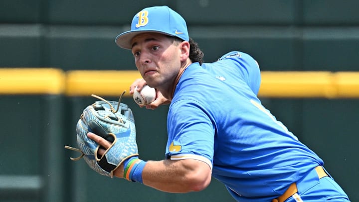Jun 14, 2025; Omaha, Neb, USA;  UCLA Bruins shortstop Roch Cholowsky (1) completes a double play against the Murray State Racers during the second inning at Charles Schwab Field. Mandatory Credit: Steven Branscombe-Imagn Images