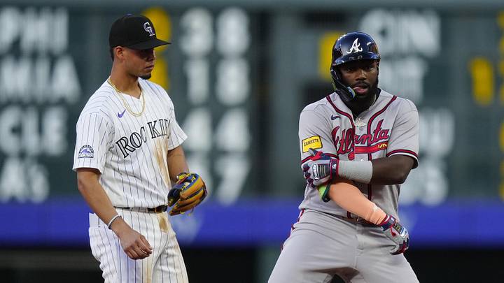 May 2, 2026; Denver, Colorado, USA; Atlanta Braves center fielder Michael Harris II (23) reacts on second next to Colorado Rockies shortstop Ezequiel Tovar (14) in the fifth inning at Coors Field. Mandatory Credit: Ron Chenoy-Imagn Images