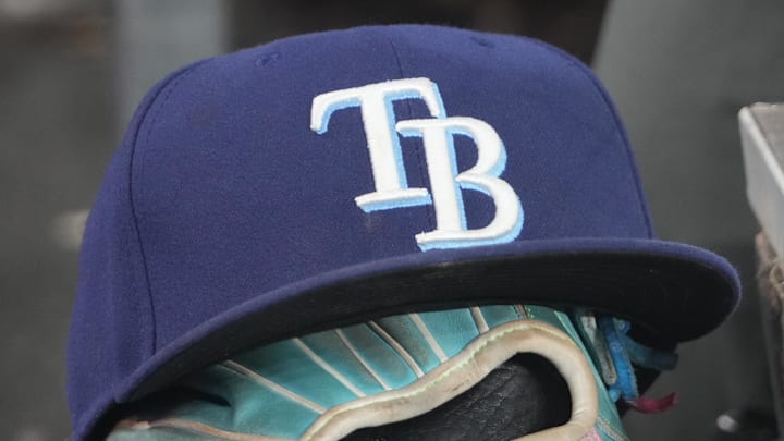 Sep 26, 2025; Toronto, Ontario, CAN; The hat and glove of Tampa Bay Rays third baseman Junior Caminero (13) in the dugout during the game against the Toronto Blue Jays at Rogers Centre. 