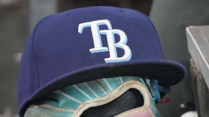 Sep 26, 2025; Toronto, Ontario, CAN; The hat and glove of Tampa Bay Rays third baseman Junior Caminero (13) in the dugout during the game against the Toronto Blue Jays at Rogers Centre. 