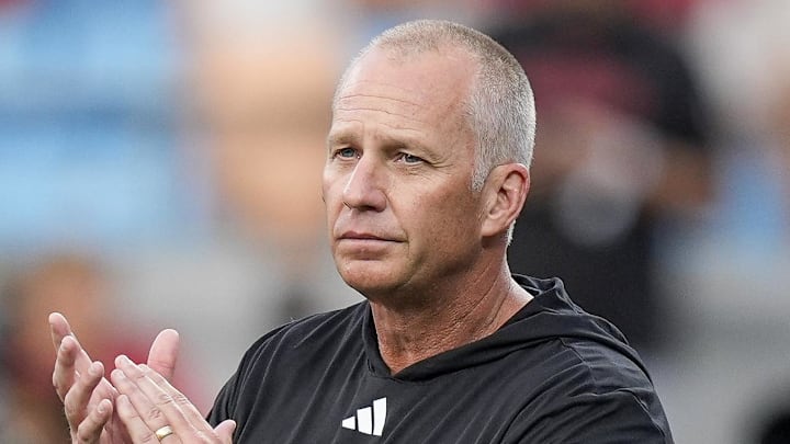 Sep 7, 2024; Charlotte, North Carolina, USA; North Carolina State Wolfpack head coach Dave Doeren during pregame activities against the Tennessee Volunteers at the Dukes Mayo Classic at Bank of America Stadium. Mandatory Credit: Jim Dedmon-Imagn Images