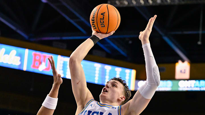 Nov 11, 2024; Los Angeles, California, USA; UCLA Bruins forward Tyler Bilodeau (34) shoots over Boston University Terriers forward Matai Baptiste (0) during the second half at Pauley Pavilion presented by Wescom. Mandatory Credit: Robert Hanashiro-Imagn Images Nov 11, 2024; Los Angeles, California, USA; UCLA Bruins forward Tyler Bilodeau (34) shoots over Boston University Terriers forward Matai Baptiste (0) during the second half at Pauley Pavilion presented by Wescom. Mandatory Credit: Robert Hanashiro-Imagn Images