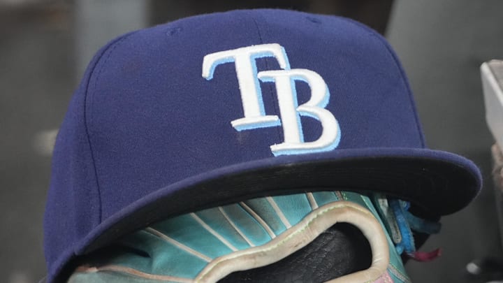 Sep 26, 2025; Toronto, Ontario, CAN; The hat and glove of Tampa Bay Rays third baseman Junior Caminero (13) in the dugout during the game against the Toronto Blue Jays at Rogers Centre. Sep 26, 2025; Toronto, Ontario, CAN; The hat and glove of Tampa Bay Rays third baseman Junior Caminero (13) in the dugout during the game against the Toronto Blue Jays at Rogers Centre.