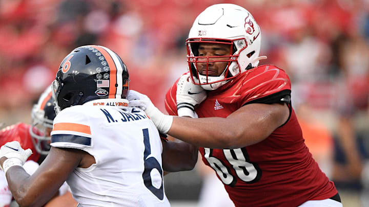 Oct 9, 2021; Louisville, Kentucky, USA;  Louisville Cardinals offensive lineman Michael Gonzalez (68) blocks Virginia Cavaliers inside linebacker Nick Jackson (6) during the second half at Cardinal Stadium. Virginia defeated Louisville 34-33. Mandatory Credit: Jamie Rhodes-Imagn Images