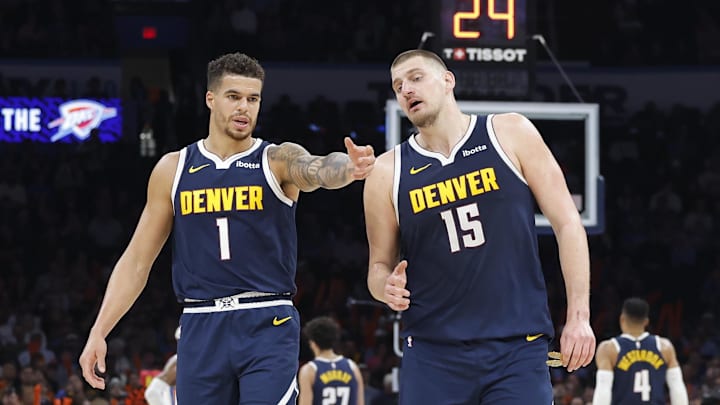 Mar 10, 2025; Oklahoma City, Oklahoma, USA; Denver Nuggets forward Michael Porter Jr. (1) and center Nikola Jokic (15) talk during a time out against the Oklahoma City Thunder during the second half at Paycom Center. Mandatory Credit: Alonzo Adams-Imagn Images Mar 10, 2025; Oklahoma City, Oklahoma, USA; Denver Nuggets forward Michael Porter Jr. (1) and center Nikola Jokic (15) talk during a time out against the Oklahoma City Thunder during the second half at Paycom Center. Mandatory Credit: Alonzo Adams-Imagn Images