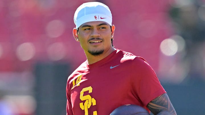 Oct 11, 2025; Los Angeles, California, USA;  USC Trojans quarterback Jayden Maiava (14) warms up prior to the game against the Michigan Wolverines at United Airlines Field at the Los Angeles Memorial Coliseum. Mandatory Credit: Jayne Kamin-Oncea-Imagn Images
