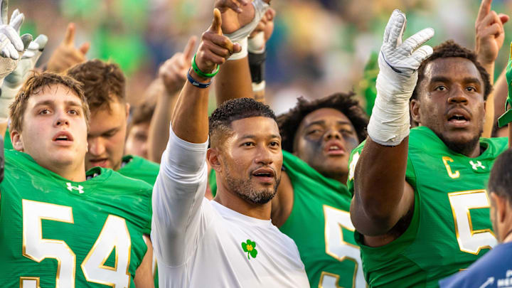 Notre Dame head football coach Marcus Freeman sings the Notre Dame Alma Mater after beating the Boise State Broncos at Notre Dame Stadium. 