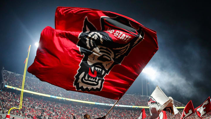 Nov 21, 2025; Raleigh, North Carolina, USA; NC State Wolfpack cheerleader celebrates a touchdown during the second half of the game against Florida State Seminoles at Carter-Finley Stadium. Mandatory Credit: Jaylynn Nash-Imagn Images Nov 21, 2025; Raleigh, North Carolina, USA; NC State Wolfpack cheerleader celebrates a touchdown during the second half of the game against Florida State Seminoles at Carter-Finley Stadium. Mandatory Credit: Jaylynn Nash-Imagn Images