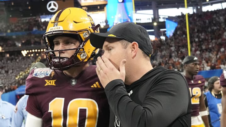 Arizona State head coach Kenny Dillingham whispers to quarterback Sam Leavitt (10) after Texas won 39-31 over Arizona State in double overtime in the Chick-fil-A Peach Bowl in Atlanta on Jan. 1, 2025. Arizona State head coach Kenny Dillingham whispers to quarterback Sam Leavitt (10) after Texas won 39-31 over Arizona State in double overtime in the Chick-fil-A Peach Bowl in Atlanta on Jan. 1, 2025.