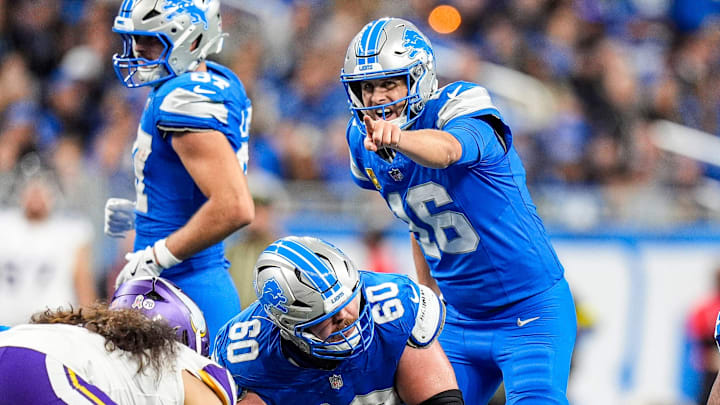 Detroit Lions quarterback Jared Goff (16) talks to guard Graham Glasgow (60) before a play against Minnesota Vikings.