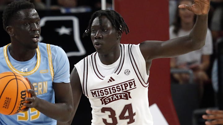 Southern Jaguars forward Delang Muon (35) handles the ball as Mississippi State Bulldogs center Gai Chol (34) defends during the first half at Humphrey Coliseum.