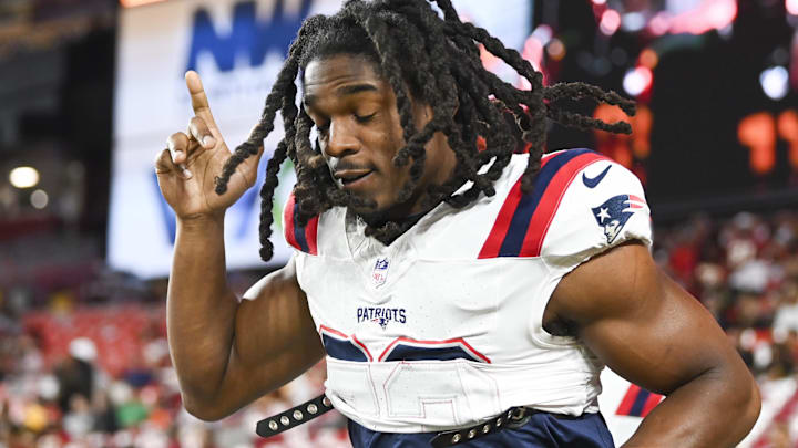  New England Patriots safety Kyle Dugger (23) takes the field before the game against the Washington Commanders at Commanders Field.