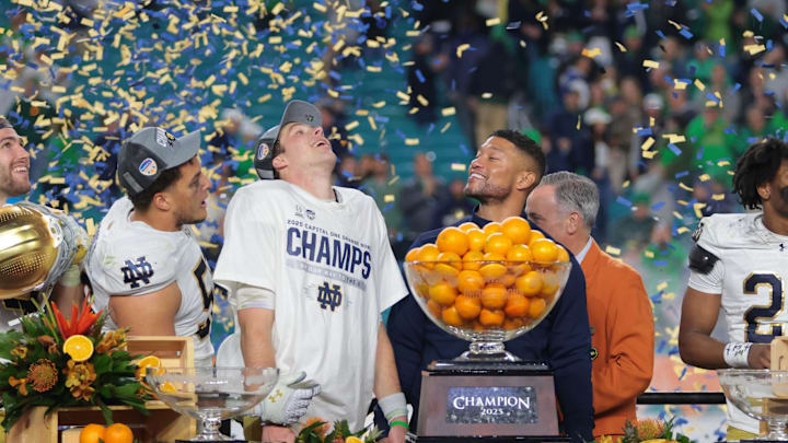 Notre Dame Fighting Irish head coach Marcus Freeman and quarterback Riley Leonard celebrate defeating the Penn State Nittany Lions in the Orange Bowl.
