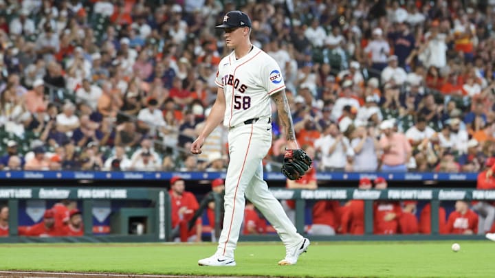 Brown walks back to the dugout. Brown walks back to the dugout.