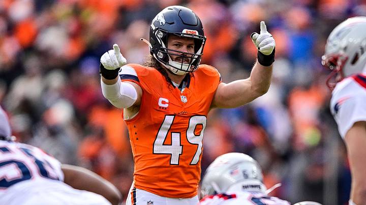 DENVER, CO - JANUARY 25: Denver Broncos linebacker Alex Singleton (49) directs the play before a snap by New England Patriots quarterback Drake Maye (10) in the first half of the AFC Championship Game. DENVER, CO - JANUARY 25: Denver Broncos linebacker Alex Singleton (49) directs the play before a snap by New England Patriots quarterback Drake Maye (10) in the first half of the AFC Championship Game.