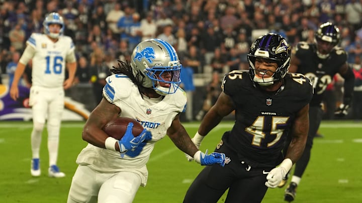 Detroit Lions running back Jahmyr Gibbs (0) rushes the ball past Baltimore Ravens linebacker Mike Green (45) Detroit Lions running back Jahmyr Gibbs (0) rushes the ball past Baltimore Ravens linebacker Mike Green (45)