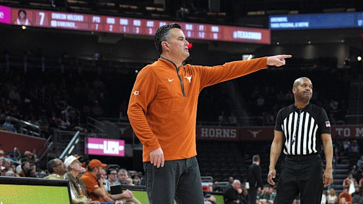 Texas Longhorns head coach Sean Miller moves players during the second half against the Le Moyne Dolphins at Moody Center. 