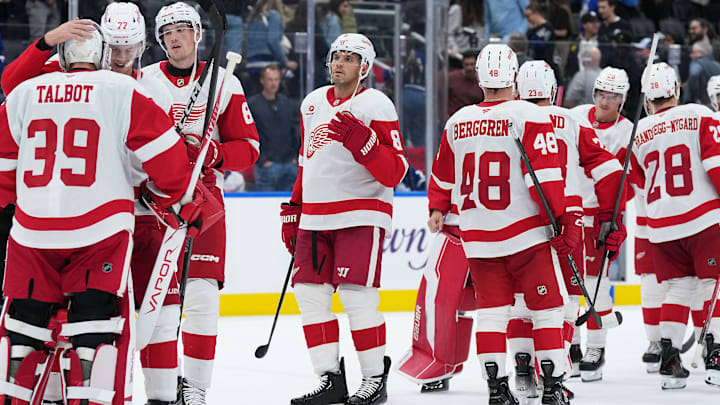 Oct 2, 2025; Toronto, Ontario, CAN; Detroit Red Wings defenseman Simon Edvinsson (77) celebrates the win with goaltender Cam Talbot (39) against the Toronto Maple Leafs at the end of the third period at Scotiabank Arena. Mandatory Credit: Nick Turchiaro-Imagn Images