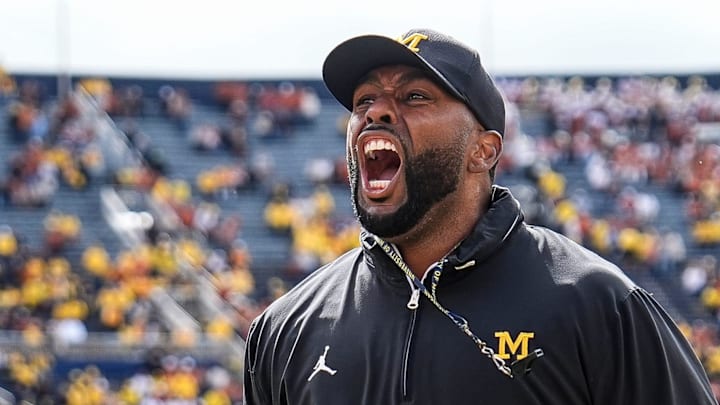 Sep 7, 2024; Ann Arbor, Michigan, USA; Michigan head coach Sherrone Moore cheers with the student section during warm ups at Michigan Stadium. Mandatory Credit: Junfu Han-USA TODAY Network via Imagn Images
