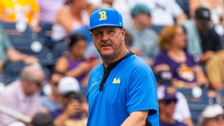 Jun 16, 2025; Omaha, Neb, USA; UCLA Bruins head coach John Savage walks off the field before the game against the LSU Tigers at Charles Schwab Field. Mandatory Credit: Dylan Widger-Imagn Images